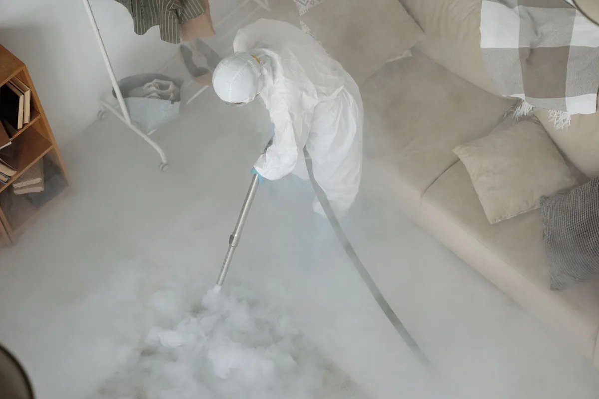 Biohazard cleanup technician in protective equipment, Oatfield, OR